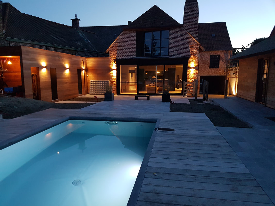 SEMMERLODGE exterior with its heated outdoor pool at dusk